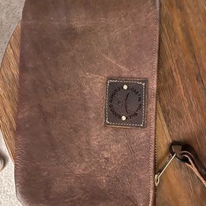 Coastal hillbilly leather goods clutch
